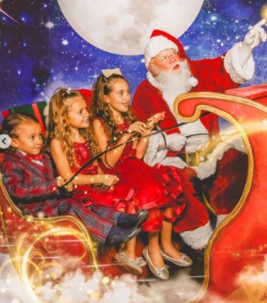 Her children with Santa Claus on Christmas Day